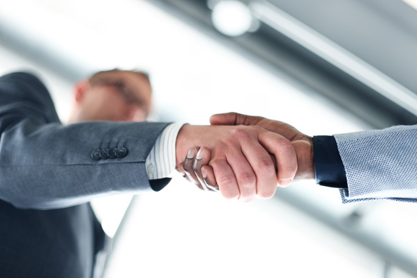 Business man giving a handshake to close the deal  - Photo, Image