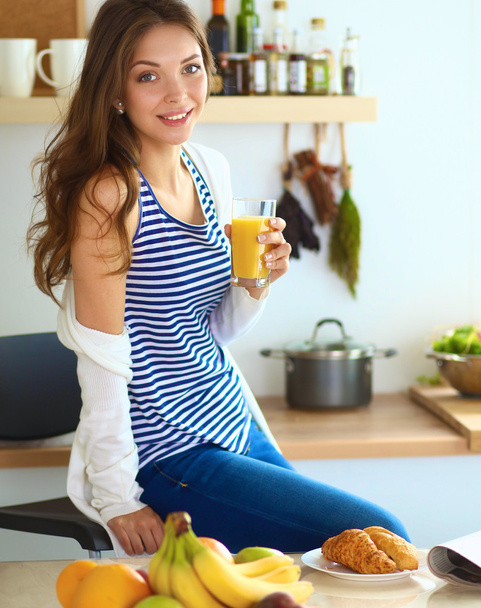 Portrait of a pretty woman holding glass with tasty juice - Foto, Imagem
