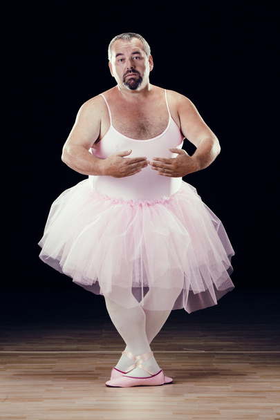 funny fat classical dancer on black background - Fotó, kép