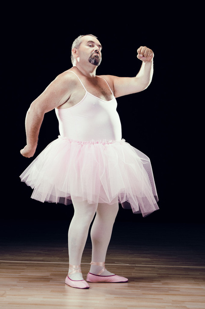 funny fat classical dancer on black background - Foto, afbeelding