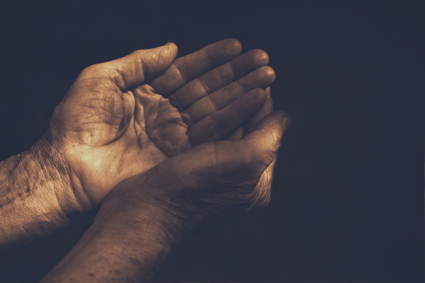 male Wrinkled old hands begging. compassion concept - Foto, afbeelding