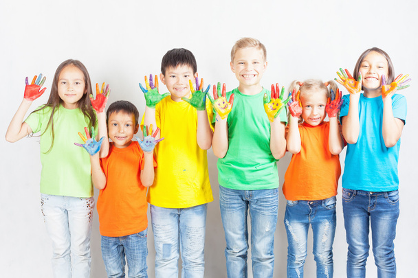 Happy kids with painted hands smiling - Foto, Bild