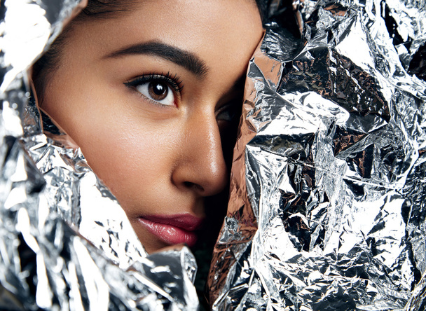 woman wrapped in silver paper - Foto, Imagem