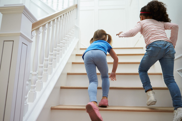 Girls Playing Game On Staircase  - 写真・画像