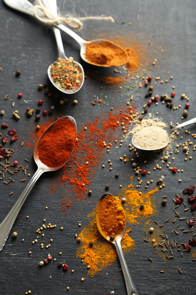 Spoons with colorful spices  - Fotó, kép