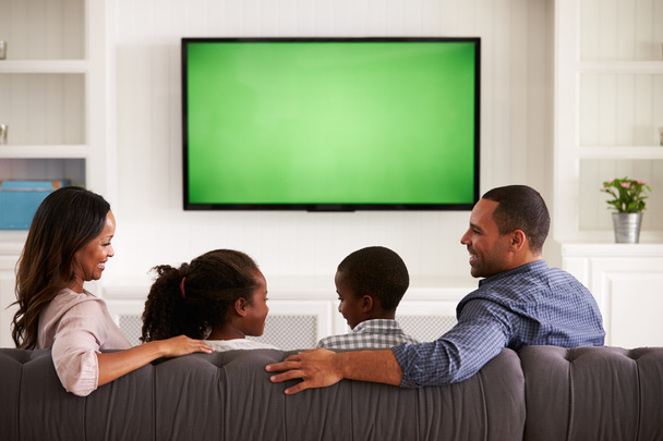 Parents and children watching TV - Foto, Imagem