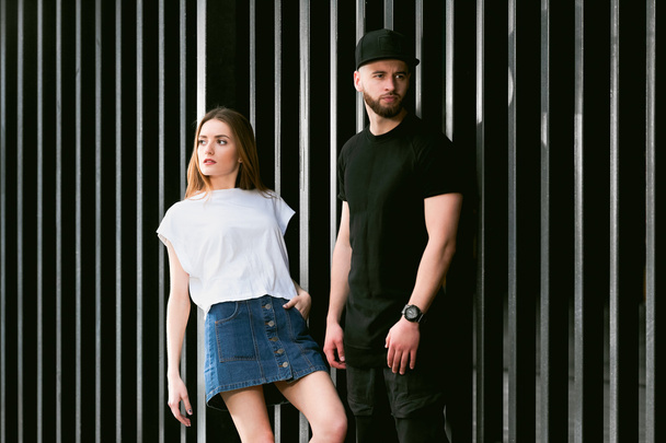 Stylish and fashionable couple posing metal fence - Photo, Image