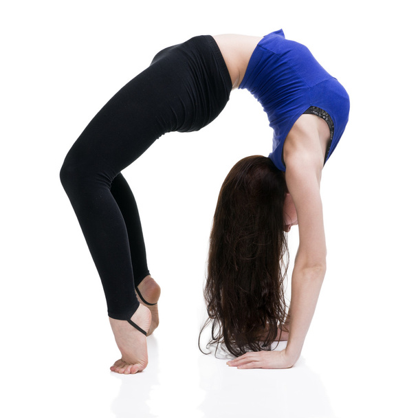Young beautiful caucasian woman in yoga pose in studio isolated on white background - Fotó, kép