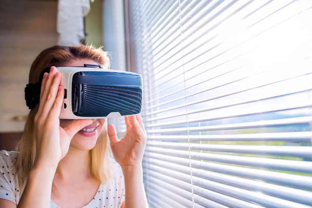 Woman wearing virtual reality goggles   - Фото, зображення
