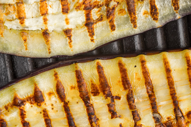Grilled eggplant slices on the metal background top view - Photo, Image