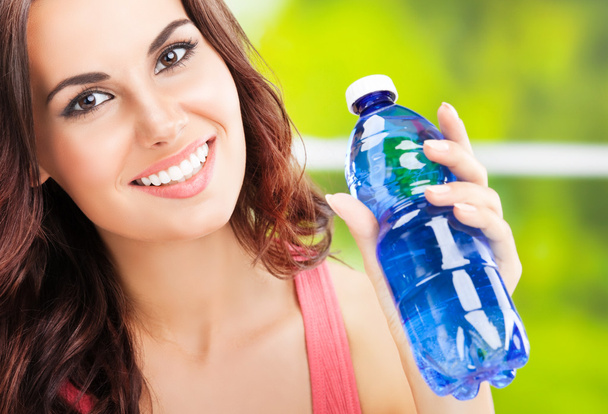 young happy woman with bottle of water - Fotografie, Obrázek