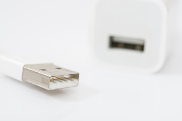USB fehér töltő adapter és Usb kábel fehér háttér - Fotó, kép