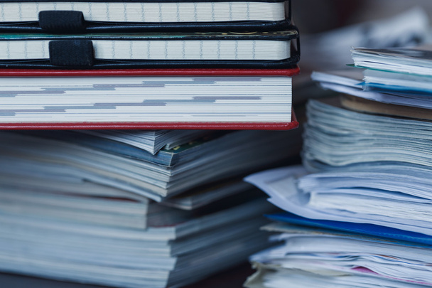 Accounting and taxes. Pile of magazine, notebook and books close - Photo, Image