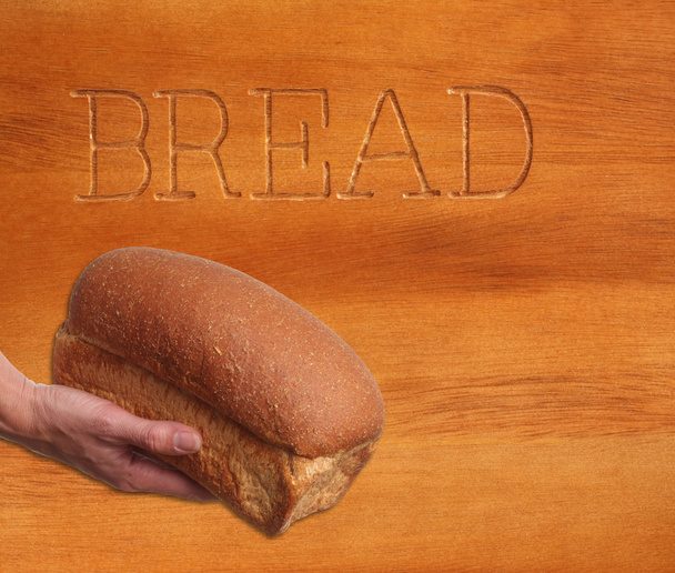 Loaf of bread, hand held. - Photo, Image