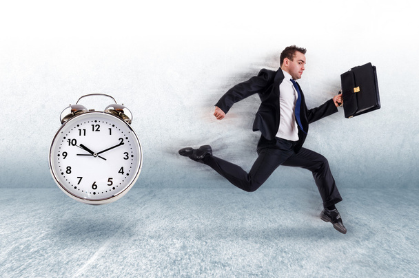 Business concept with businessman and clock - Photo, Image