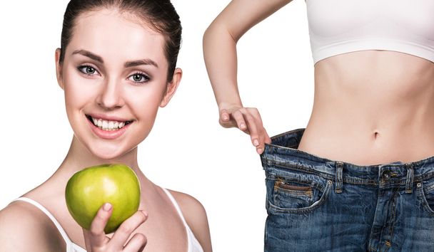 Жінка показує результати дієти у великих джинсах
 - Фото, зображення