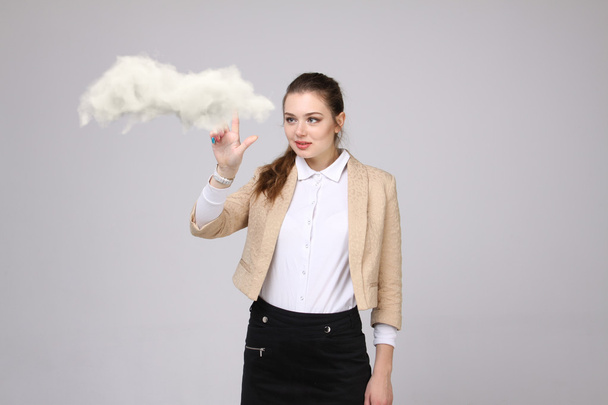 Young woman holding tablet and cloud, cloud computing concept - Foto, imagen