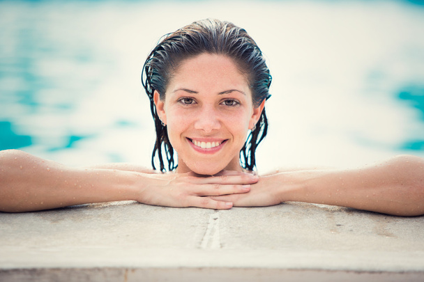 Beautiful girl in bikini at swimming pool outdoor - Foto, Imagem