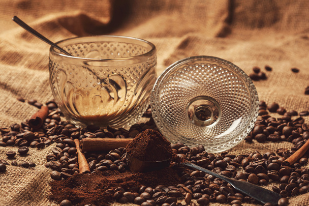 Coffee beans and scoop with milled coffee - Photo, Image