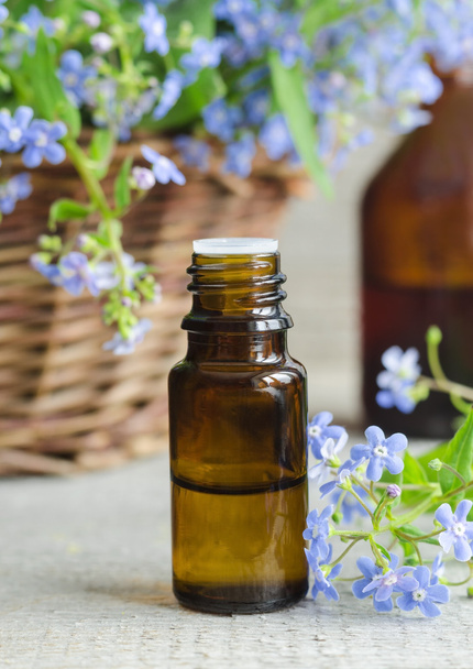 Small bottle of essential oil (Forget-me-not flowers tincrute)   - Foto, Imagem