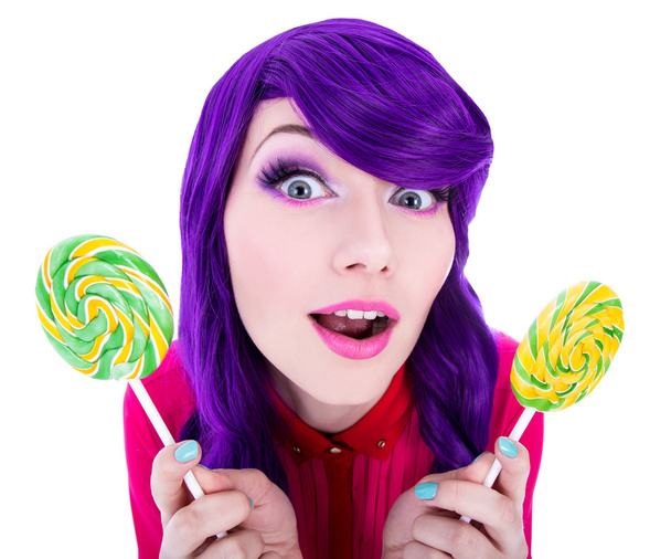 funny surprised woman with purple hair holding two lollipops iso - Photo, Image