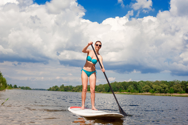 SUP Stand up paddle board woman paddle boarding05 - Zdjęcie, obraz