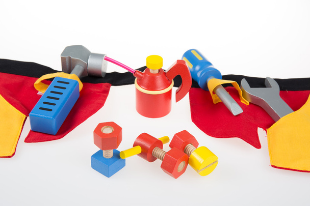 Іграшки інструменти пластикового кольору на білому тлі
 - Фото, зображення