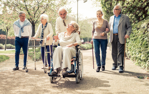 Group of old people walking outdoor - Foto, afbeelding