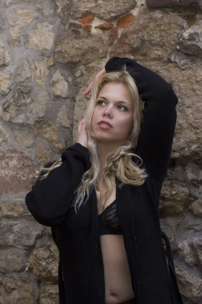 Blonde model in unbuttoned shirt near the wall - Photo, Image