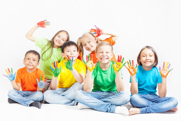 Happy kids with painted hands smiling - Fotó, kép
