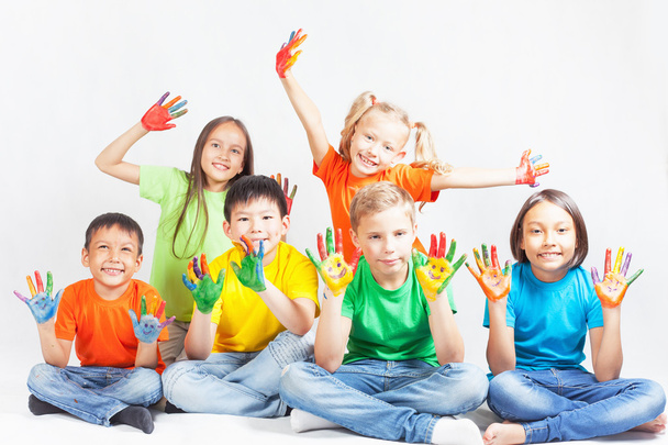 Happy kids with painted hands smiling - Photo, image