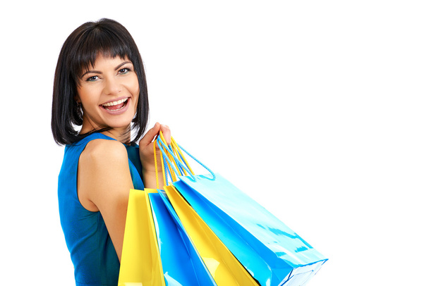 Mujer sosteniendo bolsas de compras sobre fondo blanco
 - Foto, Imagen