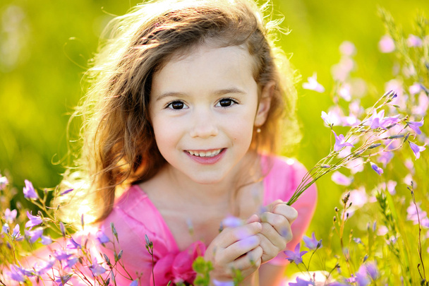 Portrait of little girl outdoors in summer - Foto, Imagem
