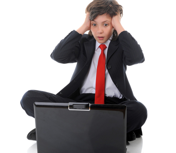 Boy in business suit sitting in front of computer - Fotó, kép