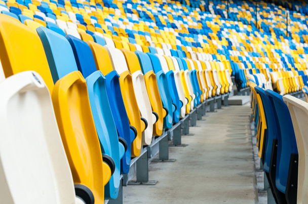 Empty plastic seats in a footbal or soccer stadium. 2016 sport background - Photo, Image