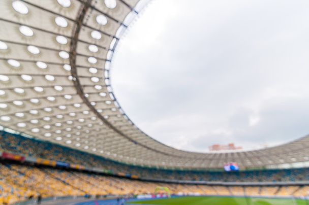 Homályos zsúfolt labdarúgó-stadion, állványok, és a nézők. sport 2016-ban háttér - Fotó, kép