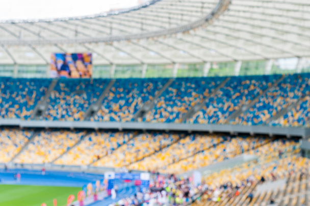 Grande arena de futebol borrada ou estádio com stands e espectadores. 2016 esporte fundo
 - Foto, Imagem