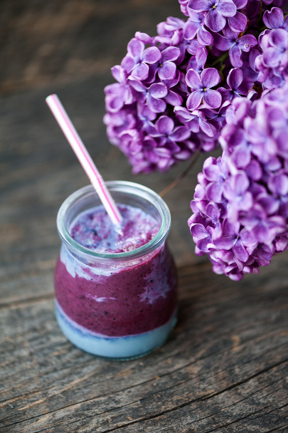 Blueberry smoothie on a wooden table - Photo, Image