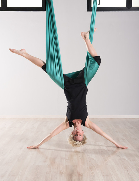 Single upside down woman doing aerial yoga - Photo, Image