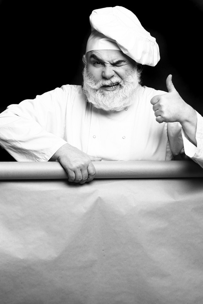 Chef man with empty paper - Photo, Image