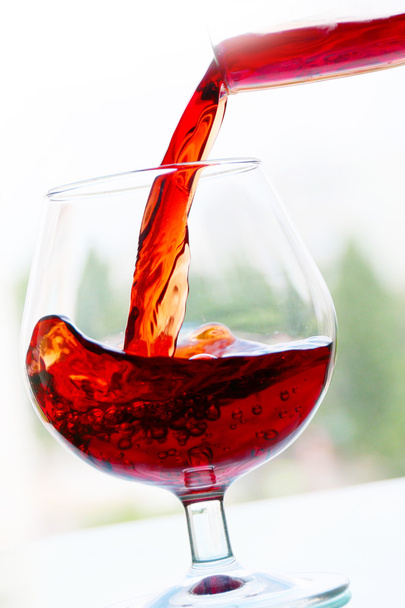 red wine in a glass - Fotó, kép