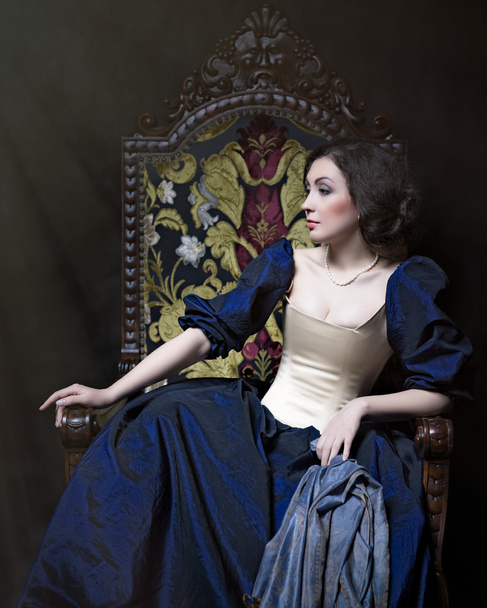 Beautiful girl wearing a medieval dress. Studio works inspired by Caravaggio. Cris. XVII - Zdjęcie, obraz