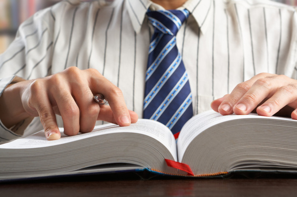 Businessman or professor reading journal - Photo, Image