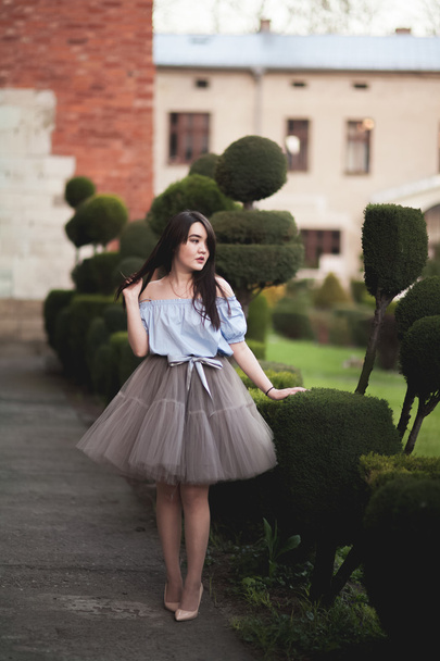 Young Asians girl with modern dress posing in an old Krakow - Photo, Image