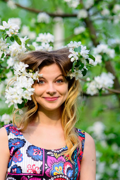 Beautiful woman in blooming garden - Zdjęcie, obraz