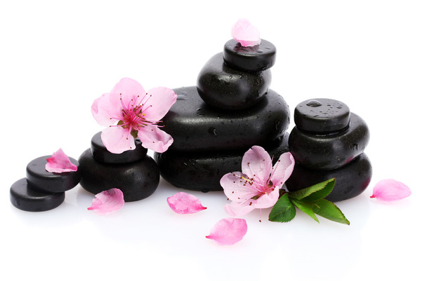 Spa stones with drops and pink sakura flowers isolated on white - Фото, зображення
