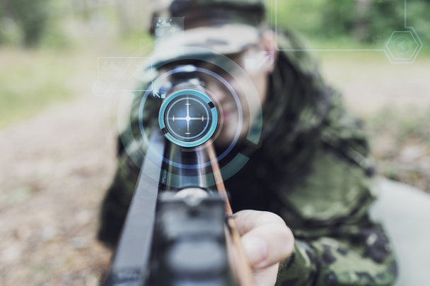 close up of soldier or sniper with gun in forest - Foto, imagen