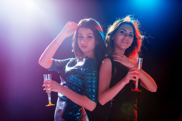 Two beautiful girls dancing at the party - Foto, Imagem