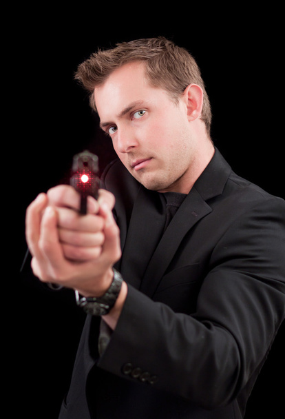 Kaukázusi Férfi modell a fegyvert - Fotó, kép