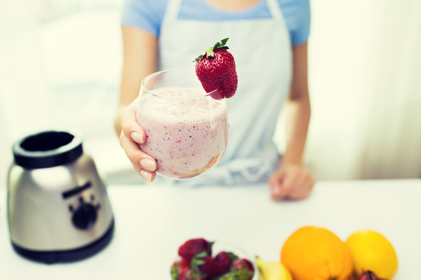 close up of woman holding glass with fruit shake - Photo, Image